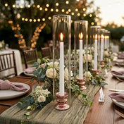 Glass Chimney Candle Shade 2.5" x 12" tubes on lit taper candles lining an elegant outdoor table - thumbnail number 6