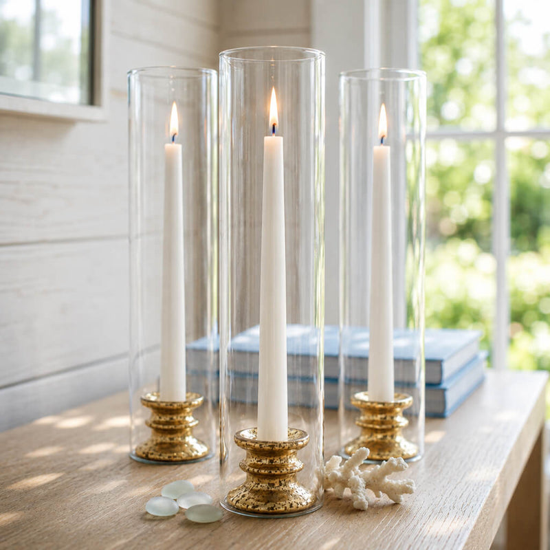 Glass Chimney Candle Shade 2.5" x 12" tubes covering lit taper candles on a bright coastal table - thumbnail number 7