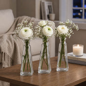 Three 6 oz. pyramid glass bottles with white ranunculus and baby's breath - thumbnail number 6