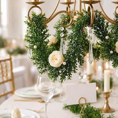 9ft faux boxwood garland wrapped around a chandelier with white roses and crystals - thumbnail number 4