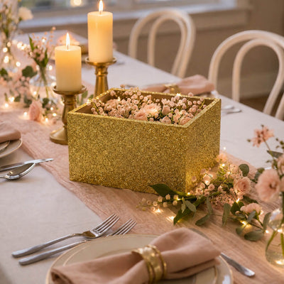 Gold glitter planter box filled with pink flowers on a wedding table setting - thumbnail number 3