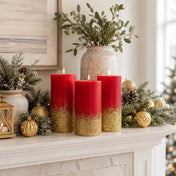 Red pillar candles dipped in gold glitter on a holiday mantelpiece - thumbnail number 9