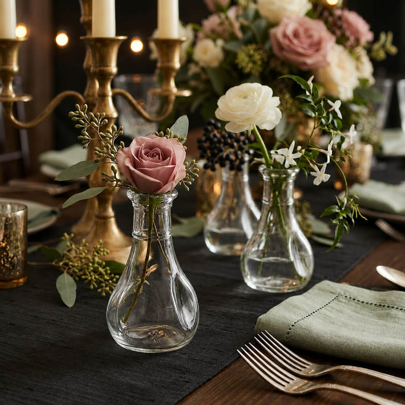 3.5" pinched bud vase with a single mauve rose and greenery on a dining table - thumbnail number 3