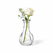 A 3.5" pinched bud vase with a white rose and greenery on a white background - thumbnail number 2