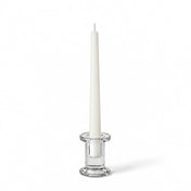 Simple Glass Taper Candle Holder holding a single unlit white candle on a solid white background - thumbnail number 2
