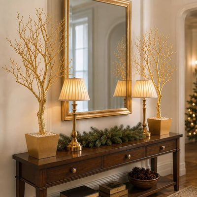 Two potted gold faux manzanita trees flanking a mirror on a console table - thumbnail number 10