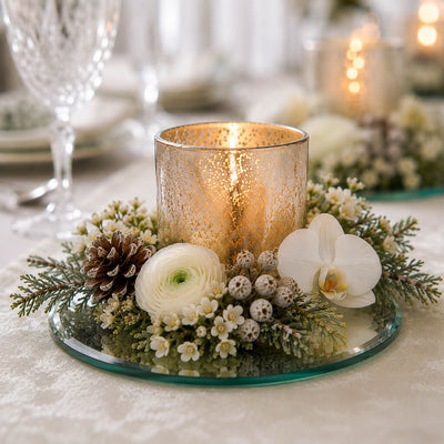 Lit candle in a gold holder with flowers and a pinecone on a 5 inch round mirror tray - thumbnail number 2