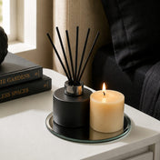 Reed diffuser and lit pillar candle on a 5 inch round mirror tray - thumbnail number 5