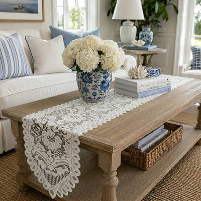 White lace table runner on a wooden coffee table in a living room - thumbnail number 9