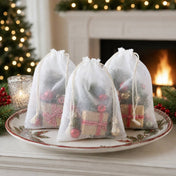 White 5x7in muslin favor bags filled with Christmas gifts and ornaments on a holiday table - thumbnail number 6