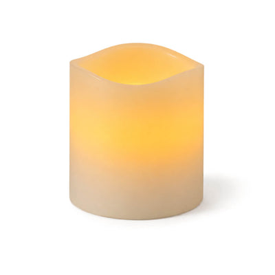 Small flameless LED wavy-top pillar candle glowing warm white - thumbnail number 2