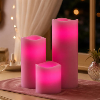 Different-sized pink flameless candles on soft pink table runner - thumbnail number 14
