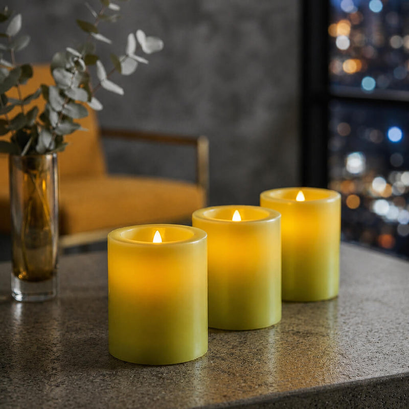 Three lit candles on a surface with a blurred background - thumbnail number 7