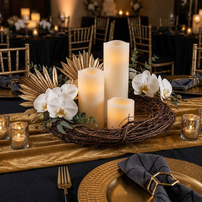 Natural grapevine wreath centered on a table with white orchids, gold palms, and LED candles - thumbnail number 4