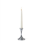 Lit white taper candle in a 5-inch silver candlestick holder on a white background - thumbnail number 3
