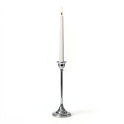 Lit white candle in a Taper Candlestick Silver 9" on a white background - thumbnail number 3