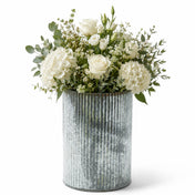 A bouquet of white flowers and greenery in a 7" corrugated zinc vase against a white background - thumbnail number 2