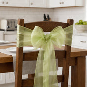 Wooden chair decorated with a sage organza sash tied in a bow - thumbnail number 10