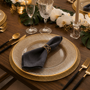 Glass charger with gold rim and dark napkin on a wooden table set for a formal dinner - thumbnail number 3