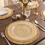 Glass charger plate with gold beaded rim on a fringed placemat set on a wooden table - thumbnail number 5