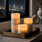 Glowing marble flameless candles on tray with city skyline night view - thumbnail number 8
