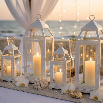 White contemporary metal lanterns with candles as centerpieces for a beach wedding - thumbnail number 3