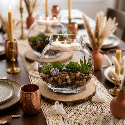 Glass bowl centerpieces with succulents, stones, and floating candles on a rustic dining table - thumbnail number 6