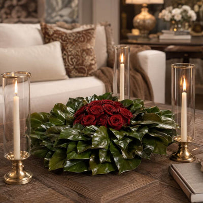 Red roses on magnolia wreath with glass candle holders - thumbnail number 2
