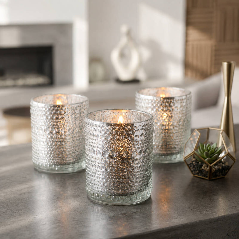 Set of pearly silver candle holders glowing on a modern tabletop display - thumbnail number 6