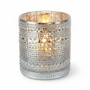 Pearly silver candle holder with glowing light on white background - thumbnail number 2