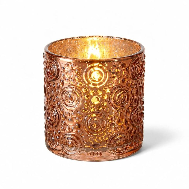 Rose gold mercury glass candle holder with glowing candle on white background - thumbnail number 2