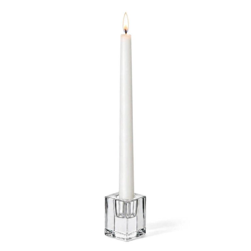 Lit white candle in a 2.5" Square Glass Taper Candle Holder on a white background - thumbnail number 3