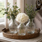 Three vintage French parfum glass bottles with flowers on a round wicker tray - thumbnail number 7