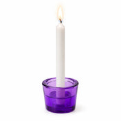 Lit white taper candle in a purple glass holder - thumbnail number 5