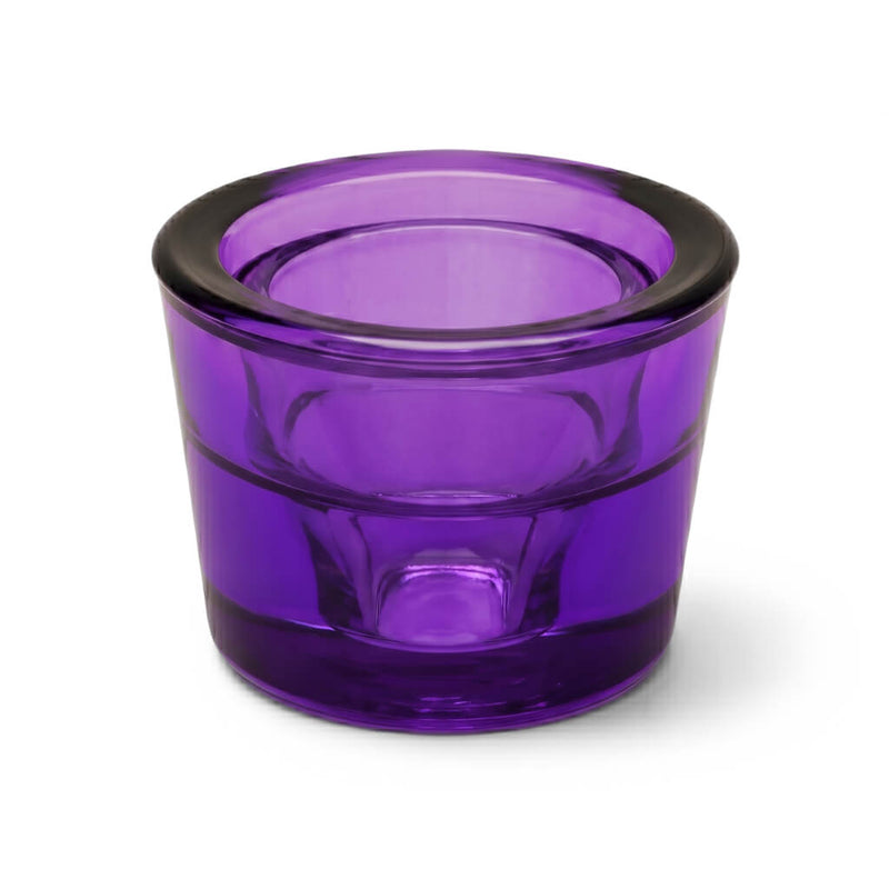 Empty purple glass votive holder on a white background - thumbnail number 1