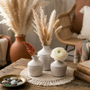 Speckled bud vases with dried stems and a flower on a macrame mat - thumbnail number 6