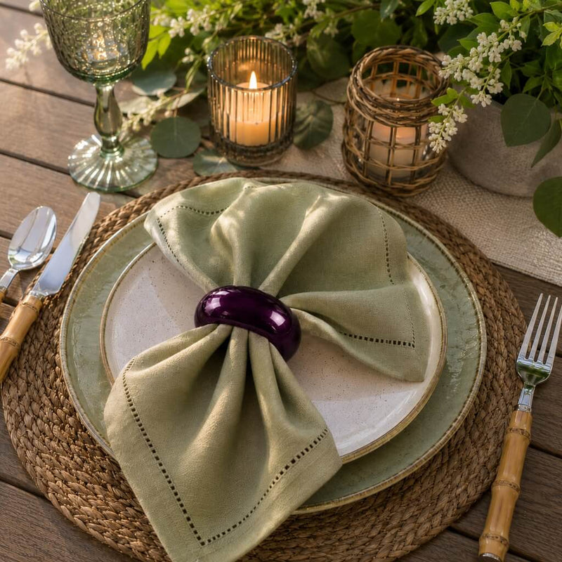 A 2.3-inch eggplant napkin ring holding a folded green napkin on a plate setting - thumbnail number 3