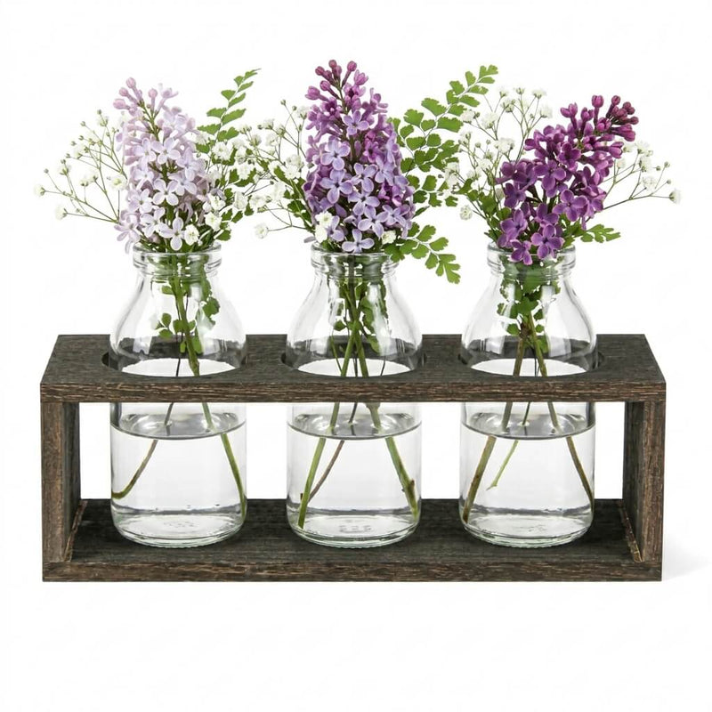 Vintage milk bottle vases with flowers in a wooden stand - thumbnail number 3