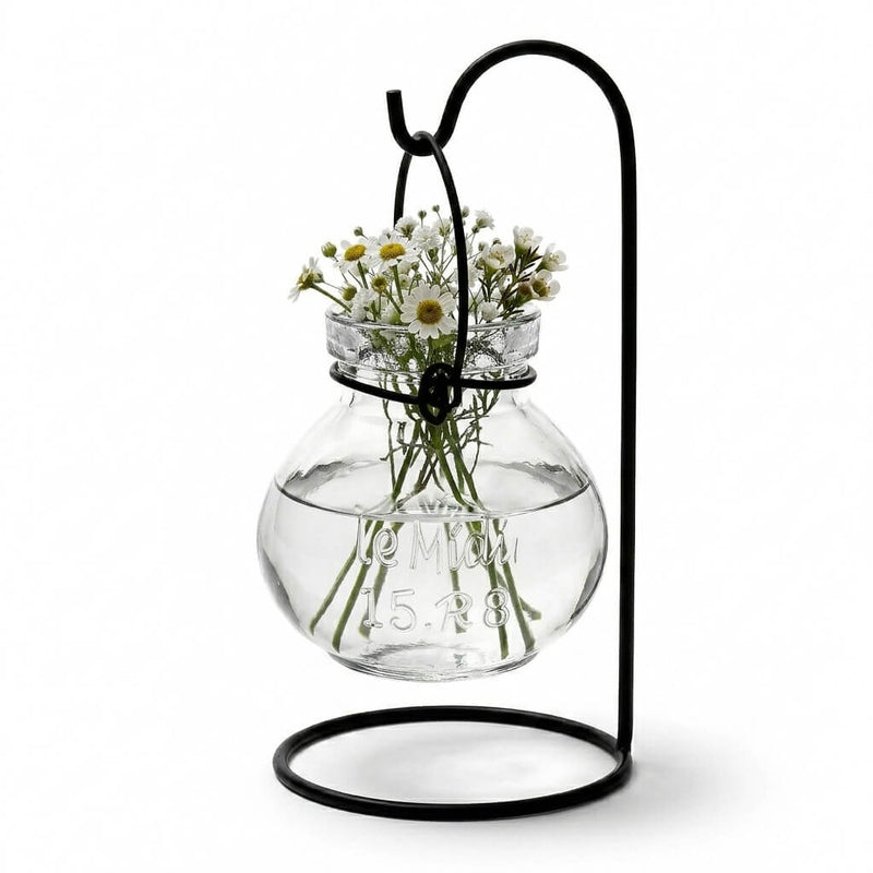Vintage Jar Hanging Glass Vase with small white flowers on a black metal stand - thumbnail number 3
