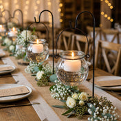 Lit tea lights in a Bubble Hanging Glass Vase on a rustic wedding table with white roses - thumbnail number 8