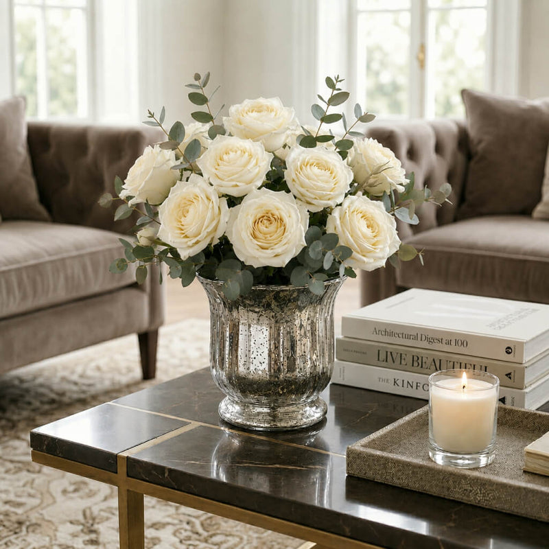 Silver Mercury Venus Jar filled with white roses on a marble table in a living room - thumbnail number 7