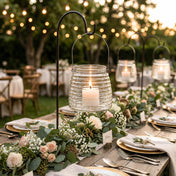 4.6" Hanging Horizontal Ribbed Glass Jar with Handle holding a candle on a garden table - thumbnail number 6