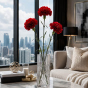 Three 27" red carnations in a cut glass vase on a table - thumbnail number 8