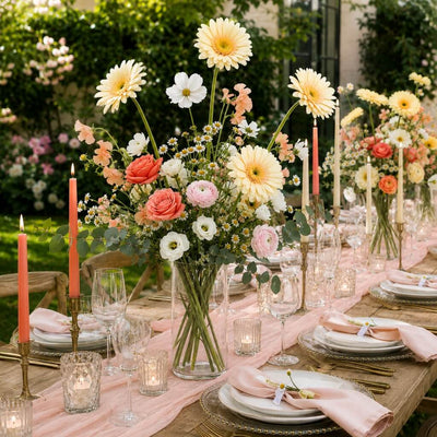 24" yellow gerbera daisies in a centerpiece floral arrangement on an outdoor table - thumbnail number 3