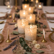 White lace votive candle holders glowing on elegant floral dinner table setting - thumbnail number 4