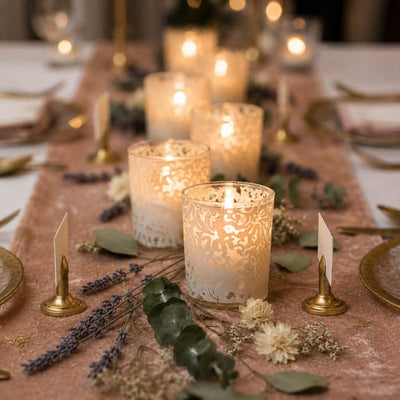White lace votive candle holders glowing on elegant floral dinner table setting - thumbnail number 4