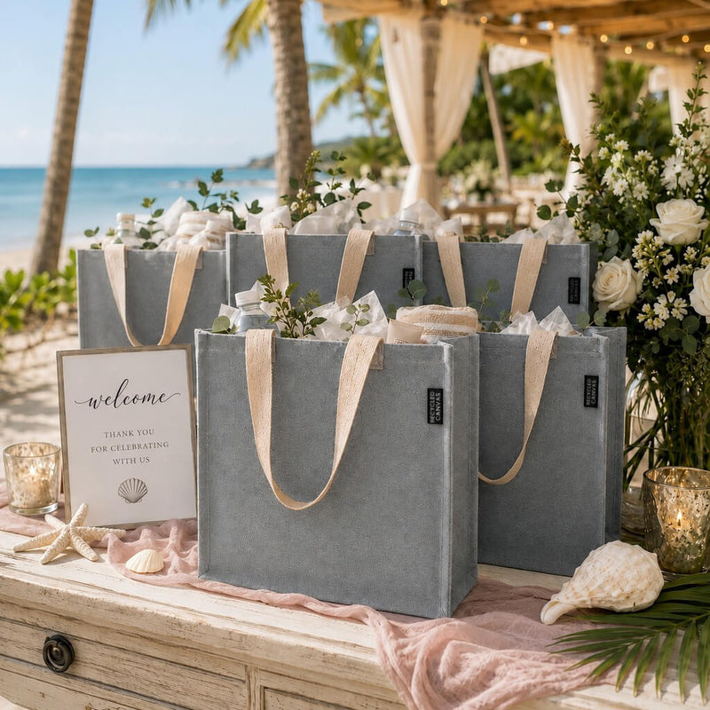 12" x 12" gray recycled canvas tote bags filled with gifts on a beach wedding welcome table - thumbnail number 6