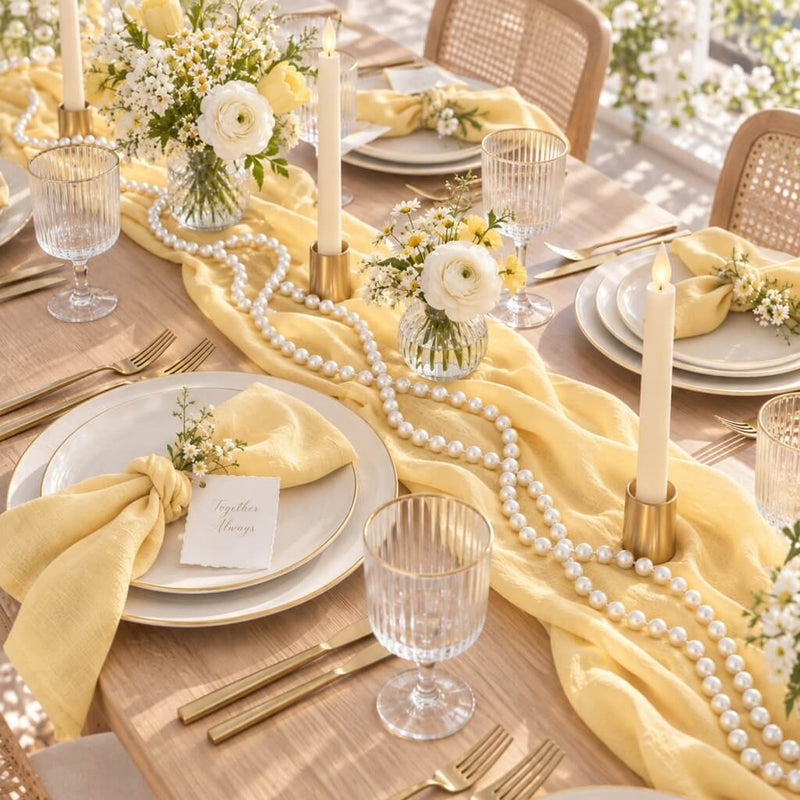 Yellow table runner draped with glossy white faux pearl beads and floral centerpieces - thumbnail number 6