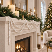 Fireplace mantel decorated with festive faux pearl bead garlands and evergreen boughs - thumbnail number 9