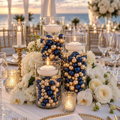 Glass vases filled with navy blue and gold pearls and floating candles - thumbnail number 6